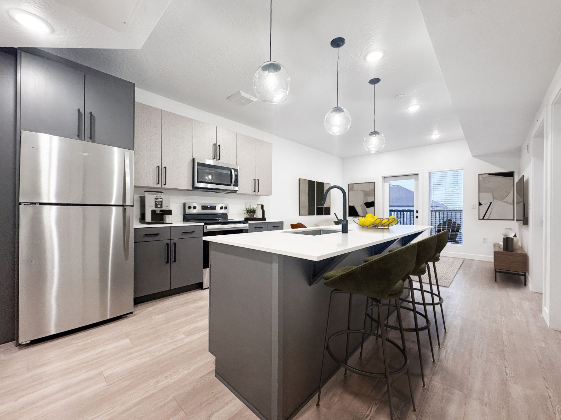 Kitchen with island seating and stainless-steel appliances