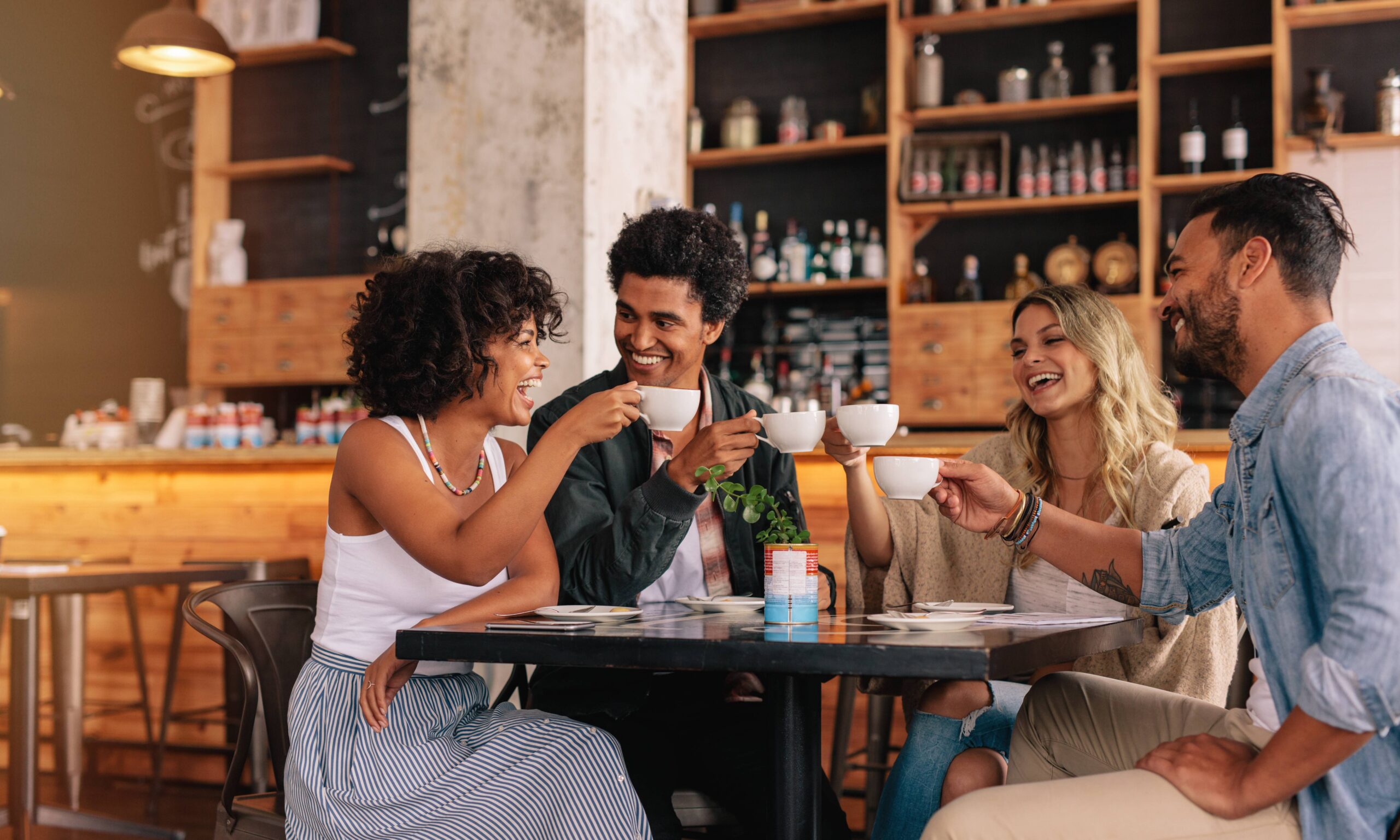 friends gathering at coffee shop scaled
